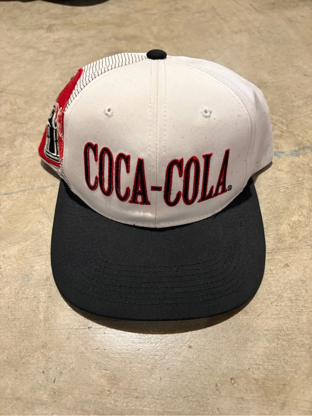 Sports Specialties Coca Cola White and Black Laser Stitch